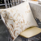 Floral Bird Pesach set featuring elegant cream fabric with gold floral branch design displayed on a chair, ideal for Seder table décor.