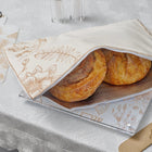 French Toile Challah Board by Waterdale Collection with two golden loaves on decorative blue and white patterned tray.