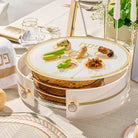 Tiered lucite Seder plate featuring a sophisticated herringbone design, three levels for Matzah storage, and six gold-accented Seder bowls on top.
