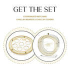 Herringbone Seder plate and matzah box set with gold accents and geometric patterns on white ceramic dishes.