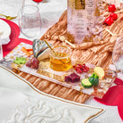 Honeycomb Simanim Tray with fish head and honey dish on top of it