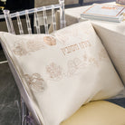 Inlay Floral Pesach pillow with embroidered cream fabric and gold floral detailing, featuring Hebrew “תלנו חשבון,” elegant Passover Seder table décor cushion, luxury Judaica holiday accent for Pesach celebration