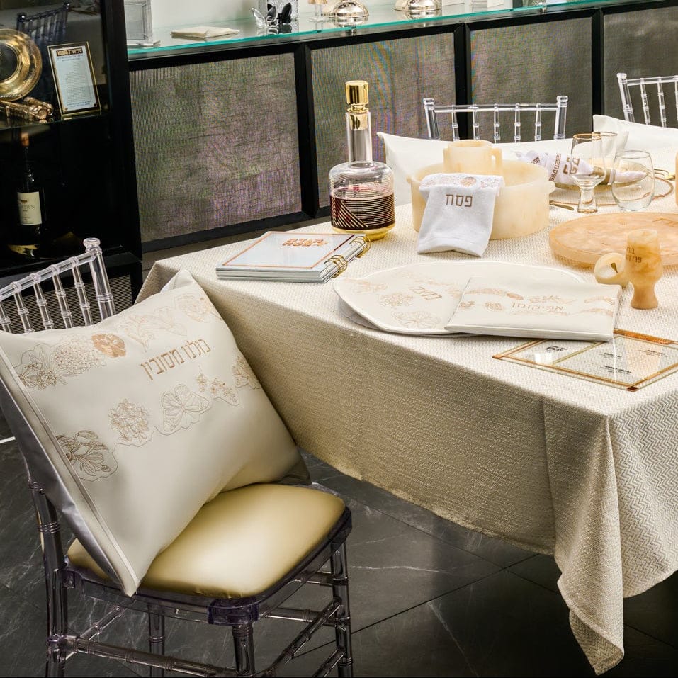 Inlay Floral Pesach Set styled on elegant Passover Seder table with embroidered cream and gold matzah cover, afikoman bag and matching décor, luxury Judaica Pesach table setting for holiday entertaining