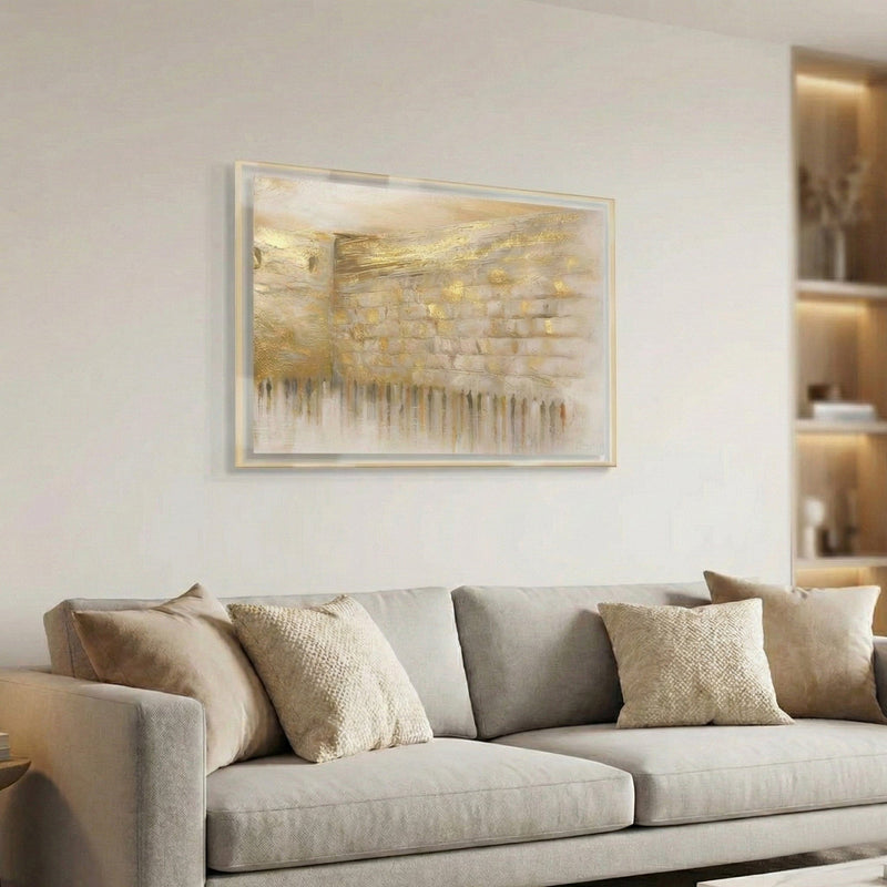 Gray sofa with decorative pillows in a living room setting, featuring a framed abstract Kosel painting on the wall. Waterdale Collection