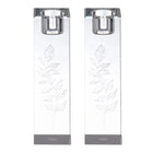 Two white Kosel Hadlokas Neiros candle lighting cards with leaf designs and gray metal clips for holding during Shabbat prayers.