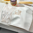 Lace Challah Cover on an elegant holiday table setting.