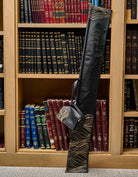 Lace Esrog Bag displayed in front of a wooden bookcase filled with Jewish sefarim.