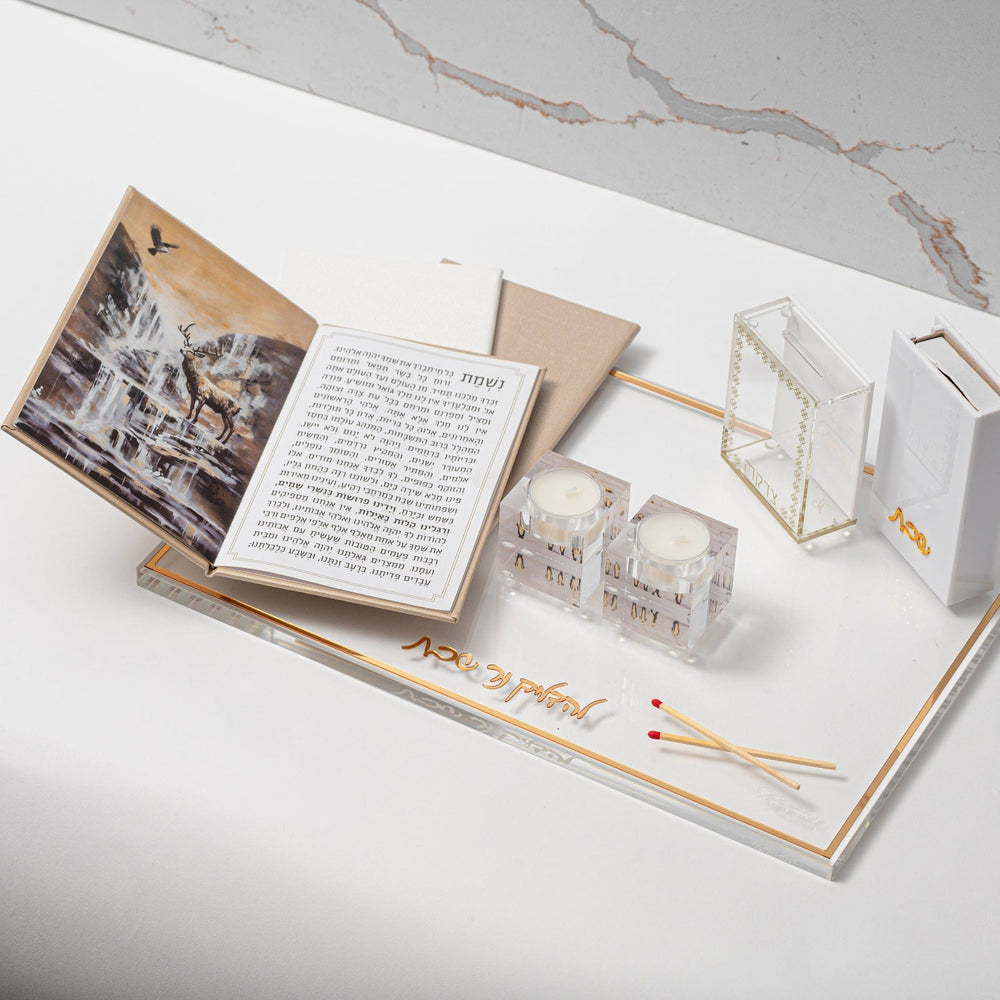 Gold Leather Painted Nishmas Booklet opened on top of a tray with tealight holder and matches| Waterdale Collection 