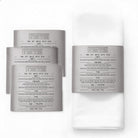 Leatherette napkin rings with silver metallic trim and removable Seder ritual cards for luxury holiday table settings — Waterdale Collection.