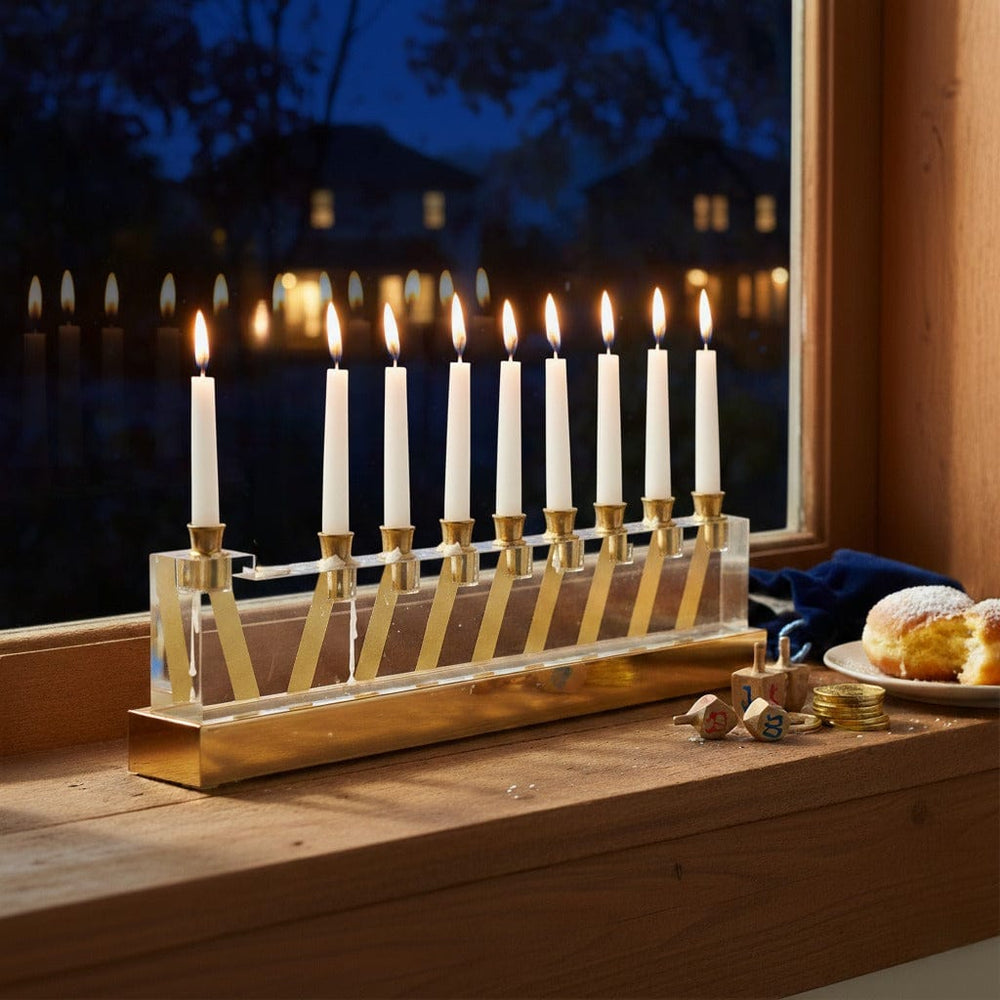Waterdale Collection - Line menorah - gold - Lucite - by a window in the dark. dreidels and donuts. 