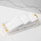 Lux Towel Set by Waterdale Collection in white with gold accents, rolled and packaged together with clear plastic wrap.