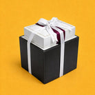 Marble silverware caddy packaged in a luxury black and white gift box with ribbon, styled for an elegant Mishloach Manos presentation.