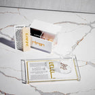 Mini Havdalah Set by Waterdale Collection displayed on marble surface, showing bundled components including candle, spices, and prayer book in cream and gold tones.