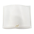 White linen challah cover with open hemstitch embroidery detail and gold accent, folded flat display view.
