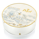 Round acrylic Matzah box with a painted Bais Hamikdash design and gold-trimmed edges — Waterdale Collection.