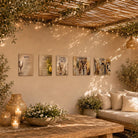 Painted by Batya sukkah decorations set of five vinyl panels hung on a sukkah wall under a string-lit bamboo roof with olive branches
