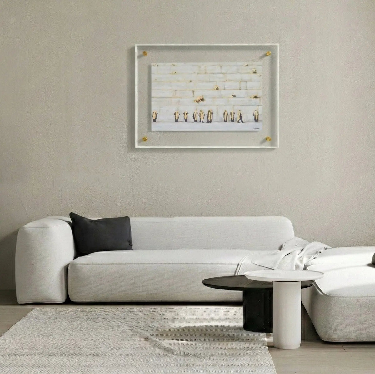 Framed Judy Kosel painting in pearl marble mat displayed above a white sofa in a modern living room setting.