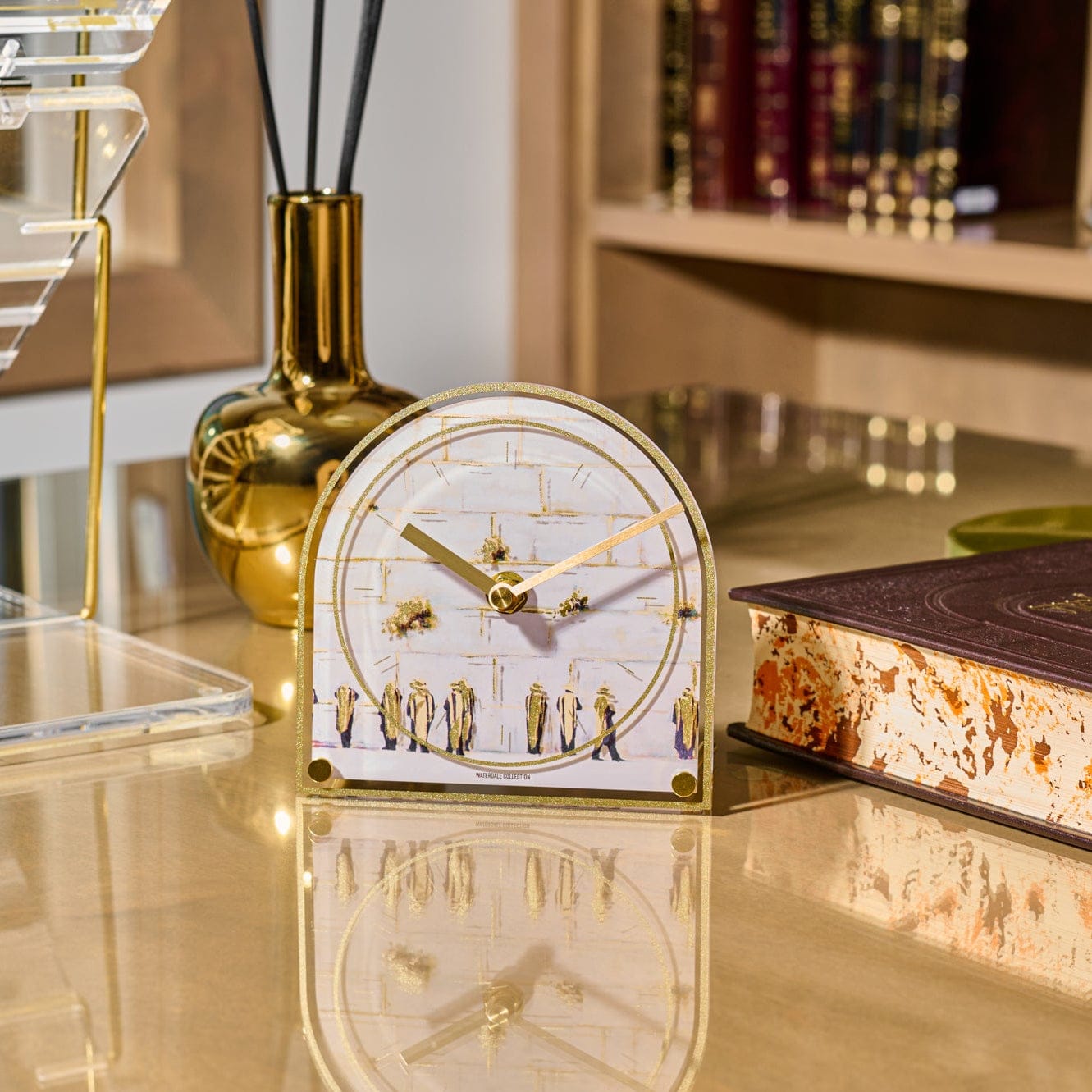 Painted by Judy Kosel Basic Desk Clock featuring Western Wall artwork, watercolor Kosel illustration, gold trim acrylic frame, gold clock hands, and rounded arch design — elegant Jewish desk décor, Jerusalem home décor gift.