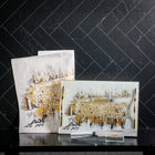 Painted Kosel at Winter Challah Board and Cover Set displayed on black tile, showing watercolor artwork of snowy Jerusalem scenes on white linen pieces.