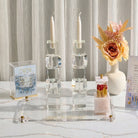 Painted Yosefa Kosel Tzedakah box styled on an elegant Shabbat table with candlesticks – Waterdale Collection