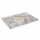 Papercut Hadlokas Neiros Tray with intricate white floral laser-cut design and gold mirror base for Shabbat candles.