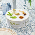 Pearlstone 3 Level Spinning Seder Plate with white and gold design, rotating Passover Seder plate with Hebrew Pesach labels and matzah storage, luxury Judaica Pesach table centerpiece for holiday entertaining.