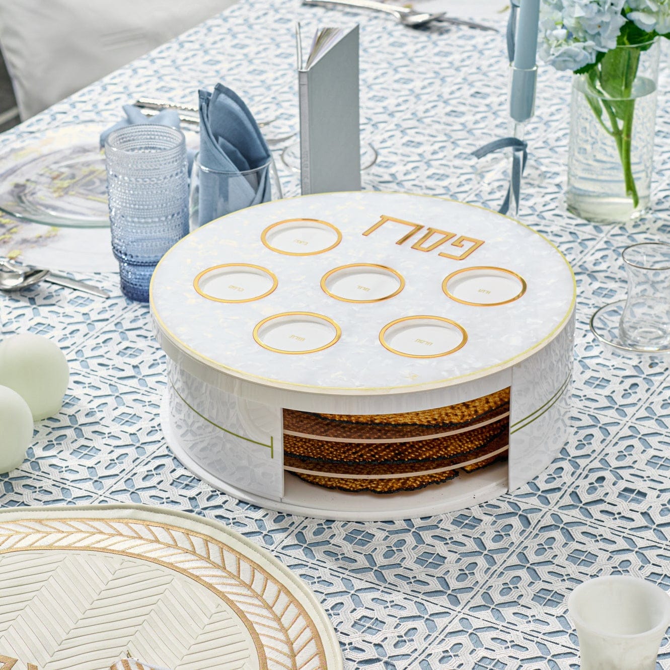 Pearlstone 3 Level Spinning Seder Plate with white and gold design, rotating Passover Seder plate with Hebrew Pesach labels and built-in matzah storage, modern Judaica Pesach table centerpiece.