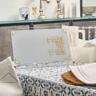 Pearlstone Haggadah Stand in white acrylic with gold Hebrew “Haggadah Shel Pesach” lettering and corner accents, elegant Passover Seder table Haggadah holder, modern Pesach table décor and Judaica accessory