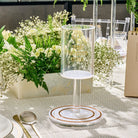 Pearlstone Kos Shel Eliyahu with white marble-look resin base and a clear lucite cup featuring gold Hebrew text.