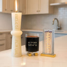 Elegant Havdalah set with Pillar Match Holder, glass of wine on a kitchen counter.