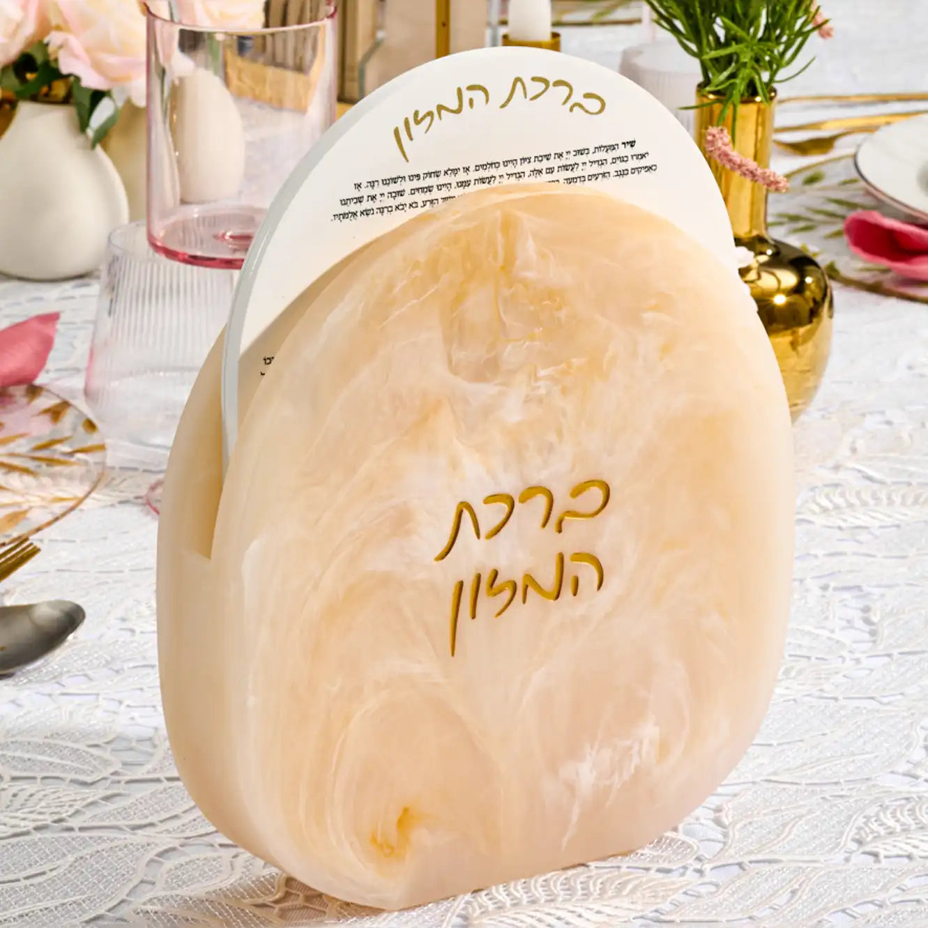 Resin marble style bencher set with white acrylic bencher cards sets inside a resin case. Set on a Shabbos table