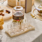 Resin Curve Liquor Set with marble-look resin tray, gold handle detail and matching glass decanter, modern Jewish barware set with multiple shot glasses for Shabbat, Yom Tov or holiday entertaining, elegant Judaica liquor serving set
