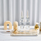 Beige marble-style resin match holder with Hebrew “אש” displayed on elegant Shabbat table setting – Waterdale Collection