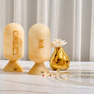 Decorative beige marble resin match holders with Hebrew lettering styled on Shabbat display – Waterdale Collection