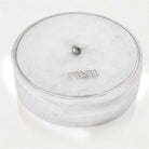 Luxury Silver resin matzah box featuring white and silver marble effect, round Passover storage design, and Hebrew inscription | Waterdale Collection