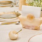 Beige marble-style resin salt cellar with spoon styled on an elegant Shabbat table setting – Waterdale Collection