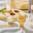 Beige resin salt cellar with spoon displayed on Passover Seder table – Waterdale Collection