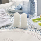 White marble-style resin salt shaker set with tray displayed on an elegant Shabbat table setting – Waterdale Collection