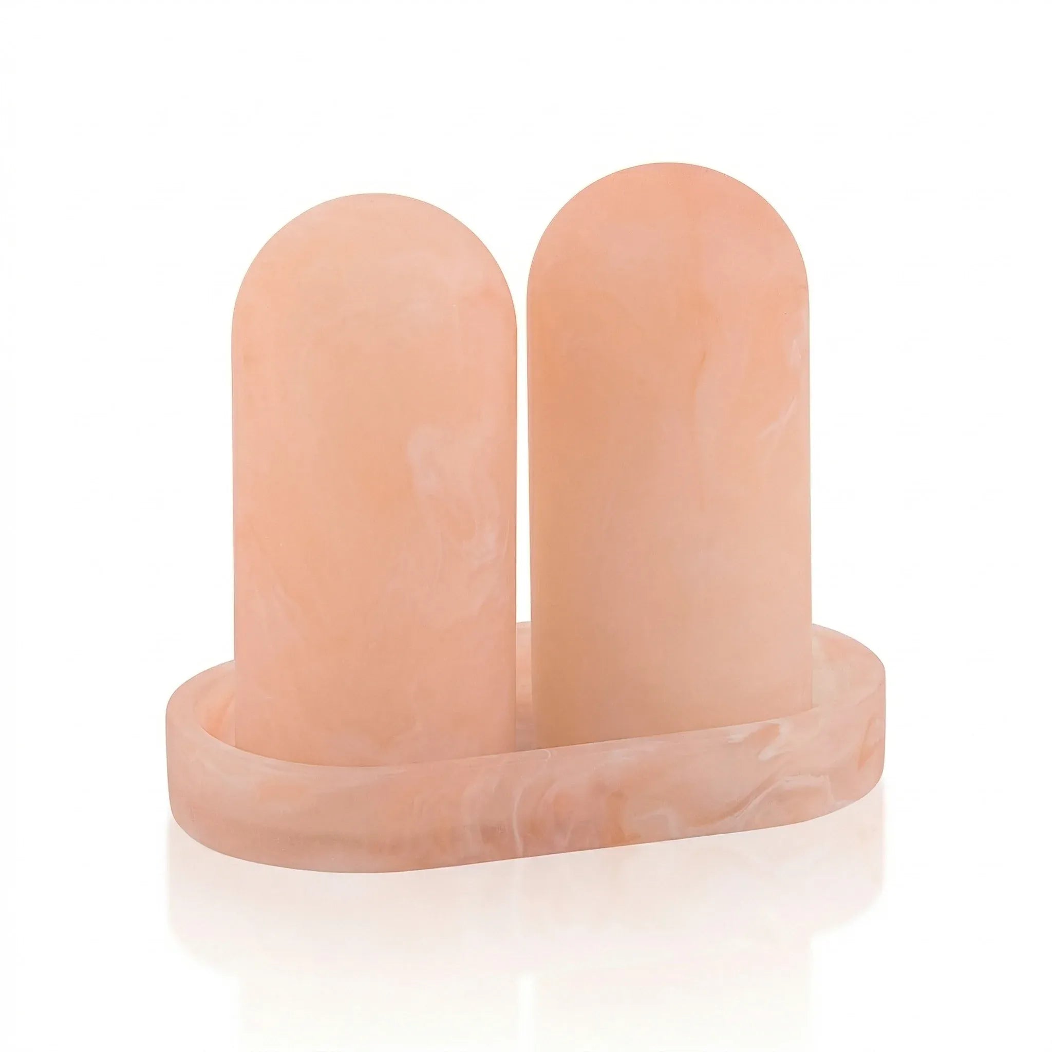 Two resin pink salt shakers on a tray on a white background - waterdale collection