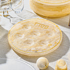 Resin Seder Plate with marble-look finish, six clear acrylic bowls, and silver accents for the Passover Seder table.