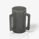 Black resin washing cup with handles on a white background