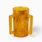 Amber resin washing cup with handles on a white background