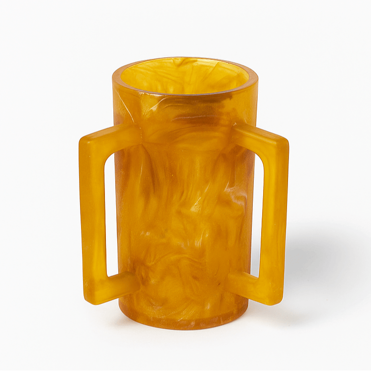 Amber resin washing cup with handles on a white background