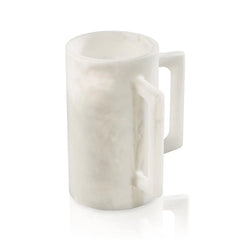 Cream-colored resin washing cup with textured surface and white handle, displayed against white background for bathroom use.