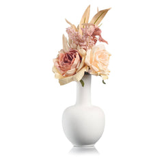 Rose faux floral arrangement in a white vase with blush and ivory artificial flowers.
