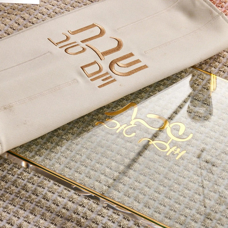Rosh Hashana 2023 Classic Tablescape with gold foil printed napkins and placemats on neutral linen.