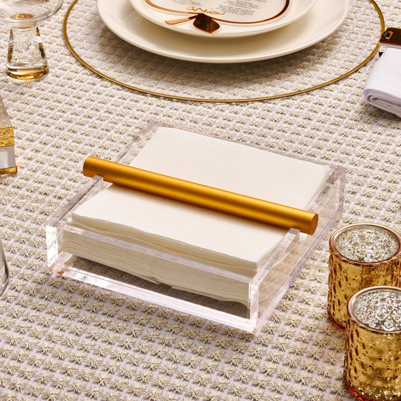 Rosh Hashana Classic Tablescape with stacked cream plates, gold utensils, and textured placemat setting on white table.