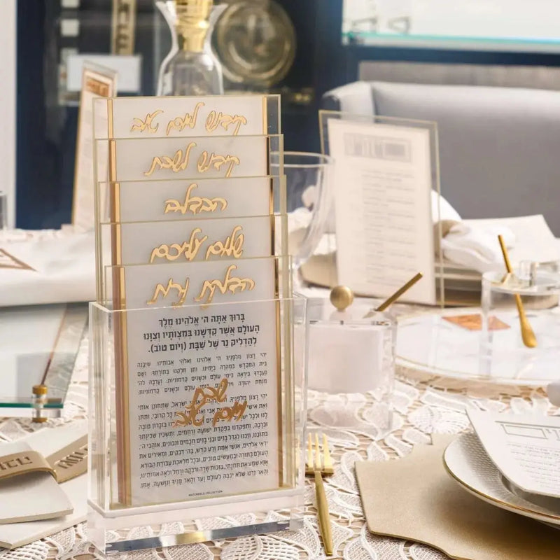 Rosh Hashanah 2024 Classic 2.0 tablescape with gold-trimmed menu cards, white place settings, and elegant table décor for holiday dining.