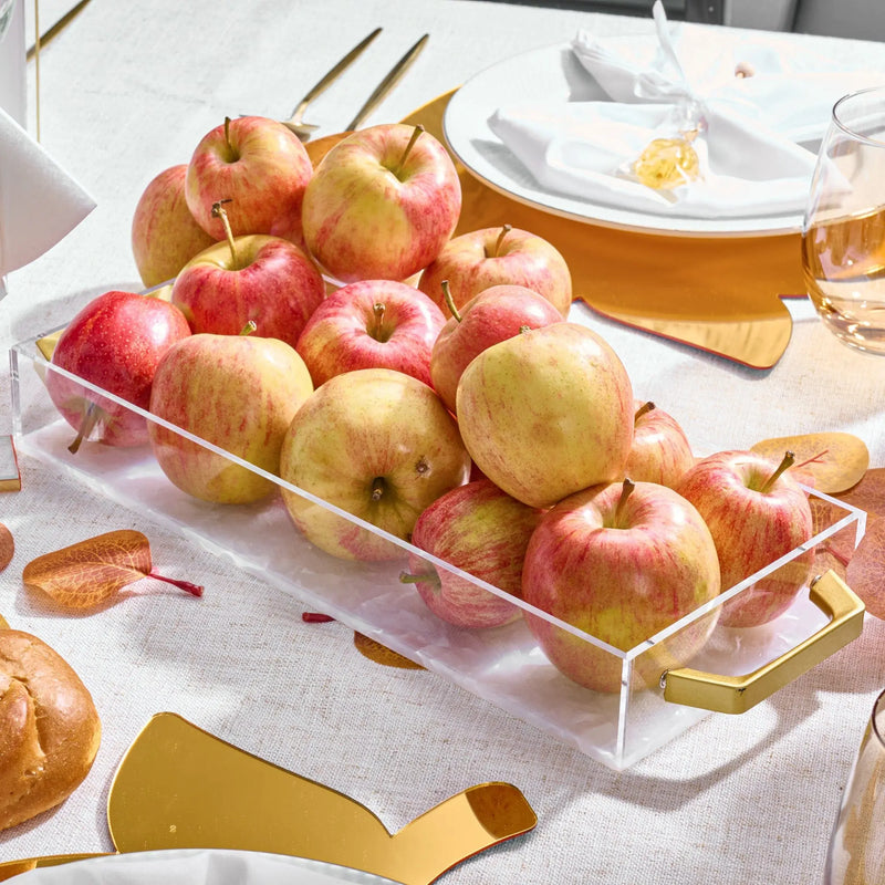 Rosh Hashanah Classic 2.0 tablescape featuring fresh apples in a clear acrylic tray with gold accents and place settings on white linens.