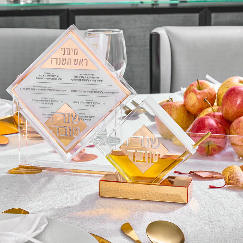Rosh Hashanah 2025 Classic tablescape featuring painted honey dish, apples, and autumn-themed table decorations for holiday dinner setup.